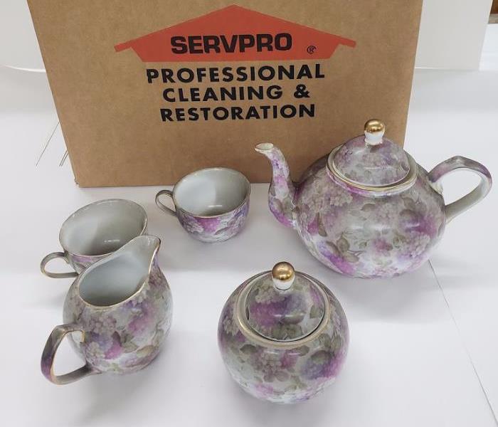 Tea cup set with smoke and soot on them